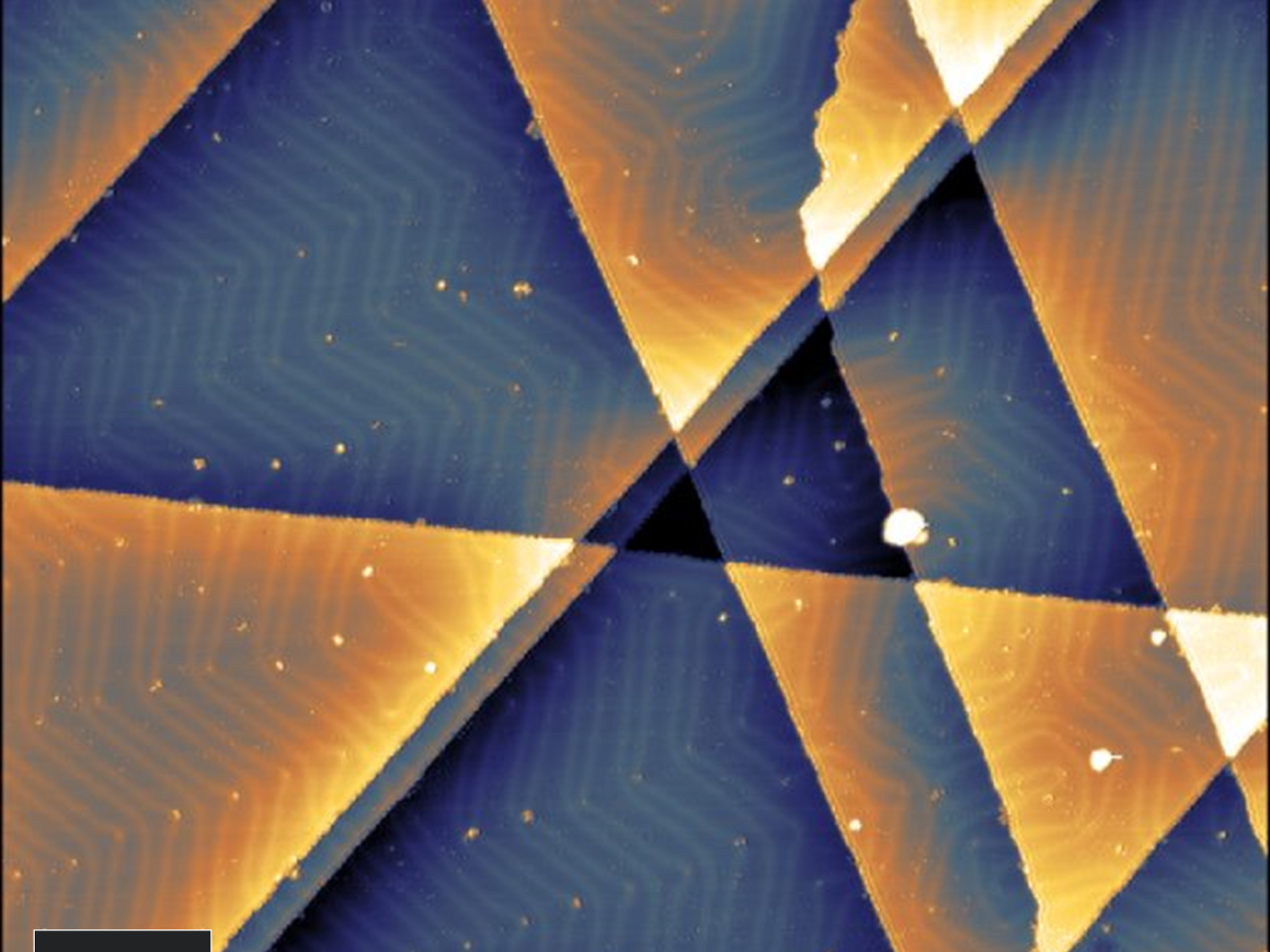 STM image showing au(111) surface with herringbone reconstruction visible across multiple terraces.