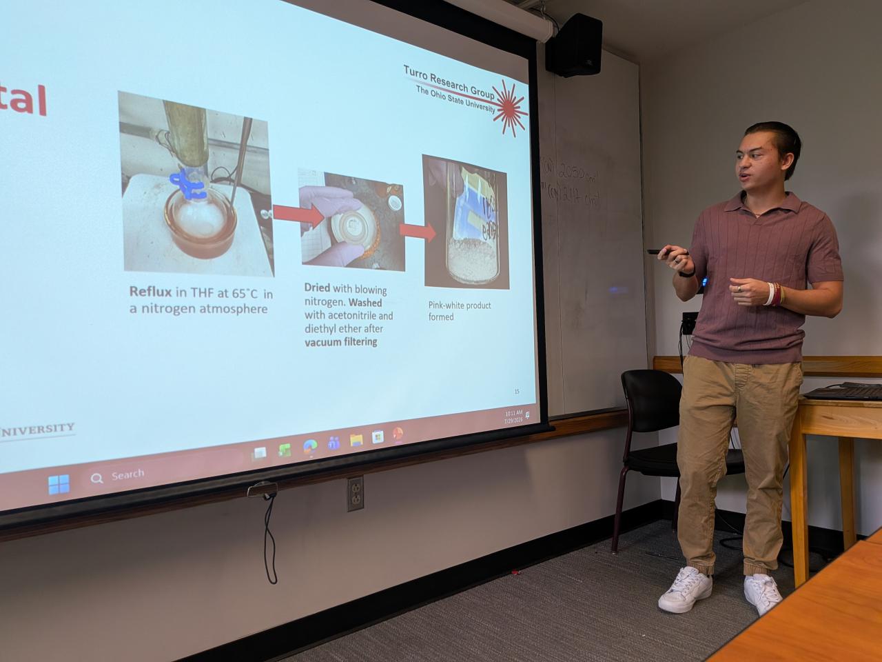 Jeremy Satterfield presenting a slide show of his research